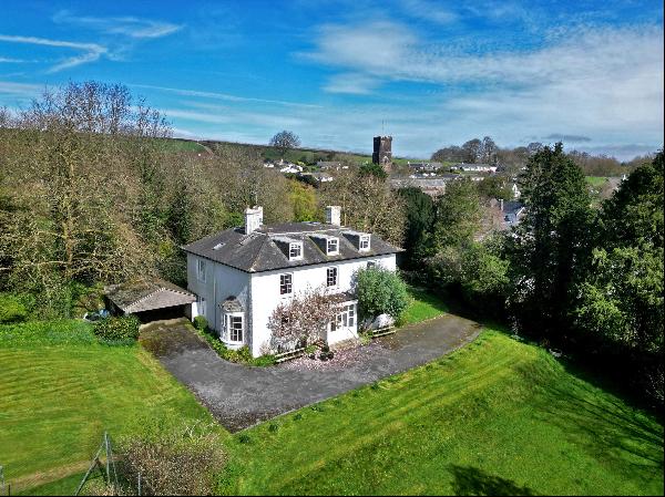 A fine, mid-Georgian village house set in 1.27 acres of walled grounds with south-facing v