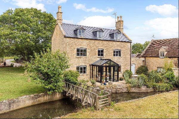 Former Mill House full of character, with views of the Cotswold hills.
