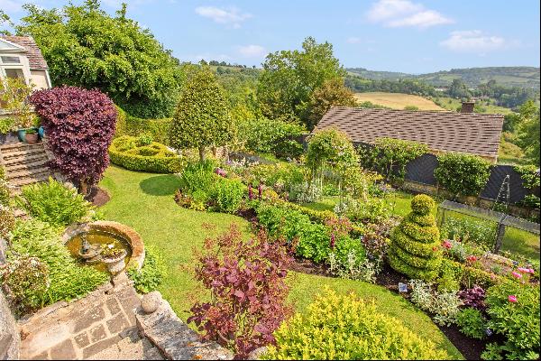 A thoughtfully extended detached family home set in beautiful gardens within the desirable
