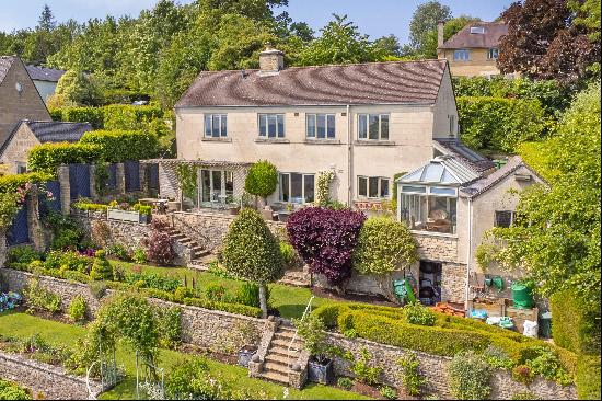 A thoughtfully extended detached family home set in beautiful gardens within the desirable