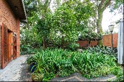 House surrounded by greenery