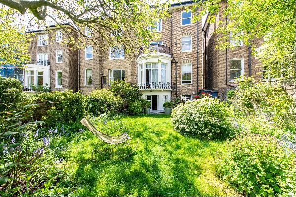 A 3 bedroom garden flat for sale on Belsize Square, NW3.
