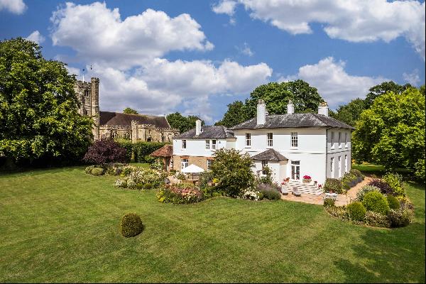A beautiful Grade II listed Georgian Vicarage positioned in the middle of its grounds.
