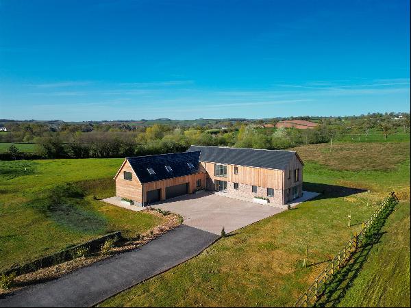 A stunning architecturally designed eco-friendly new build set in about 7 acres in a peace