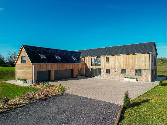 A stunning architecturally designed eco-friendly new build set in roughly 7 acres in a pea