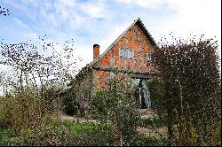 Historic half-timbered house directly on the landscape protection area