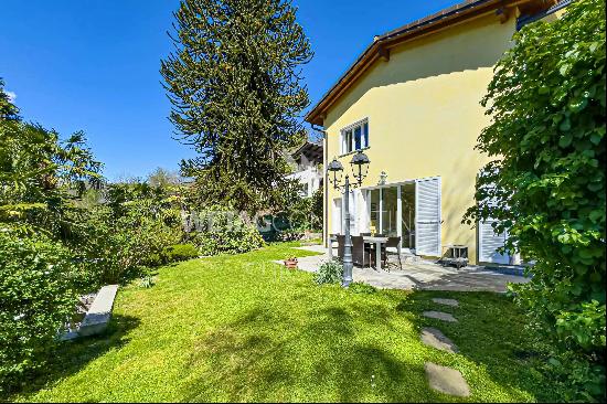 For sale in Lugano-Odogno: a delightful villa featuring an outdoor swimming pool, a detac