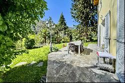 For sale in Lugano-Odogno: a delightful villa featuring an outdoor swimming pool, a detac