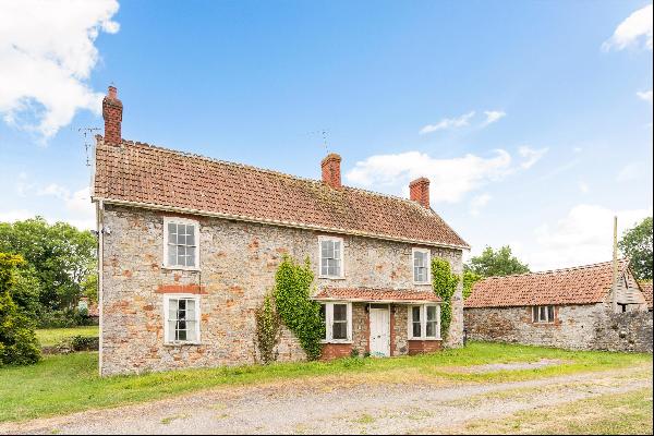 A rare development opportunity to renovate a former farmhouse and convert a range of stone
