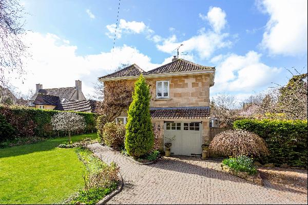 Detached four-bedroom family home in Bath with gardens, garage and parking.