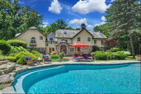 Welcome to this exquisite stone and shingle home, an extraordinary masterpiece built in th