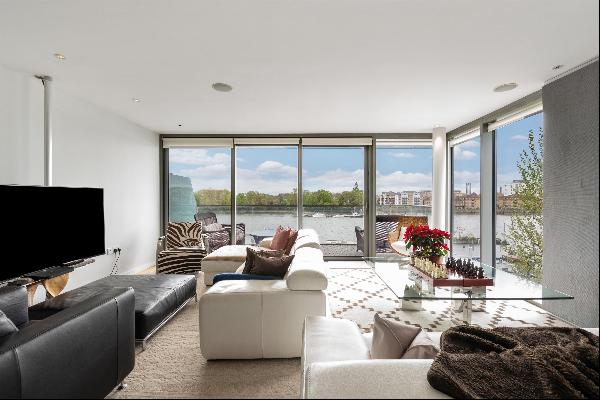A spacious three-bedroom lateral apartment with uninterrupted views of the River Thames.