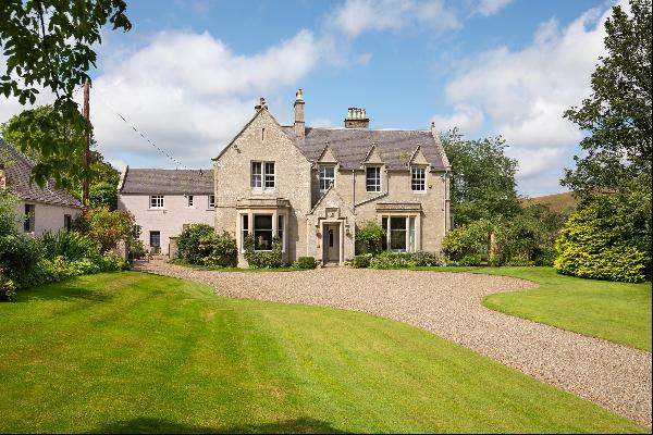 An exceptional country house with a lodge cottage, beautiful gardens and about 27 acres of