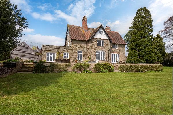 A beautifully presented Grade II listed five bedroom family home with glorious views and s