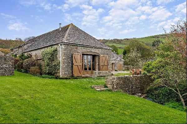 A mid-17th barn conversion in a small village with views over unspoilt countryside and Kim