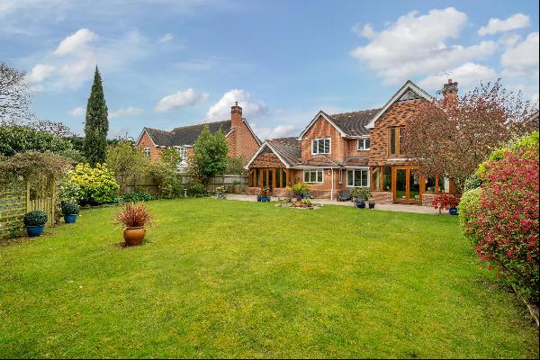 An attractive detached brick and flint family home.