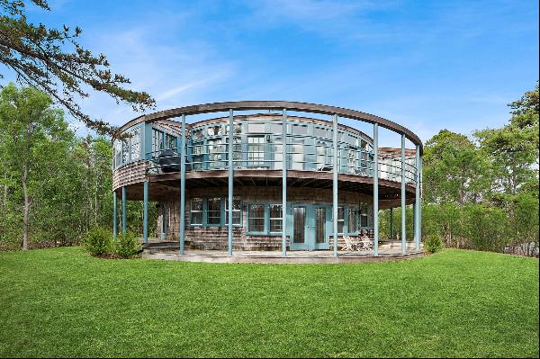 Sited on 3.5 private acres in the heart of the Devon Colony in Amagansett, one will find a