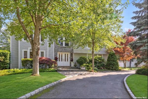 Welcome to this move-in-ready 5-bedroom center hall colonial in the prestigious Drawbridge