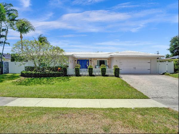 Discover the essence of East Boca living in this beautifully updated 4-bedroom, 3-bathroom