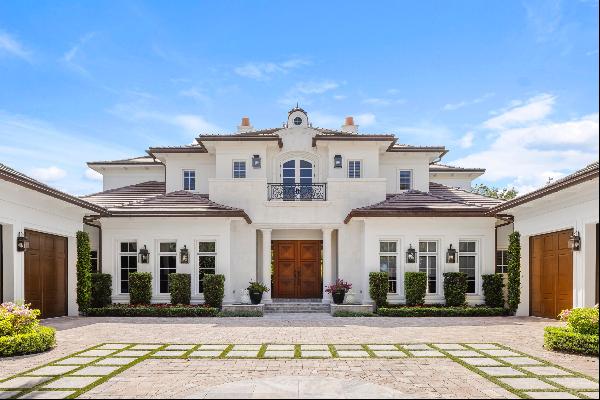 Welcome to 131 W Bears Club Drive, located on nearly 0.6 acres in Jupiter's prestigious go