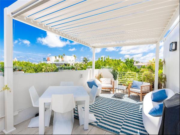 Indulge in the pinnacle of Miami Beach luxury living with this remarkable 3-bedroom townho