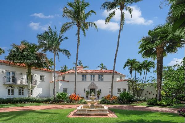 This elegant two-story 1924 Old Spanish is the epitome of quintessential living on one of 