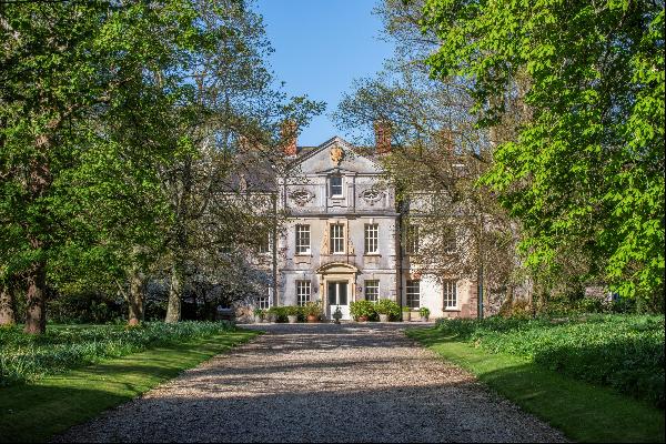 A magnificent Grade II* listed country residence in picturesque parkland grounds with a co