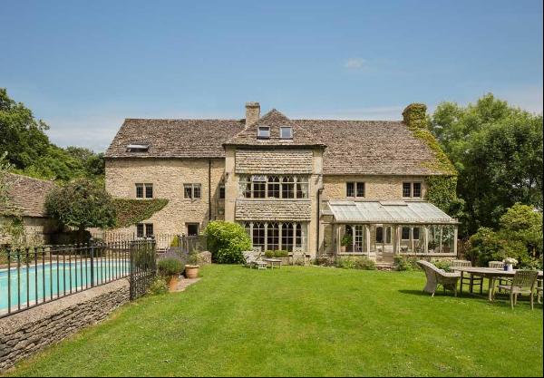 A beautifully presented and conveniently located Cotswold stone country home, created from