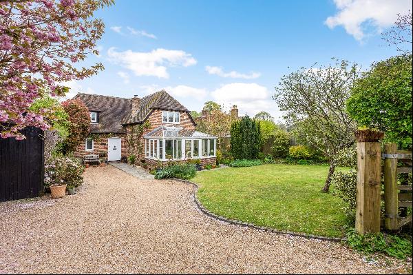 Attractive and well presented three bedroom detached house in the heart of this historic v