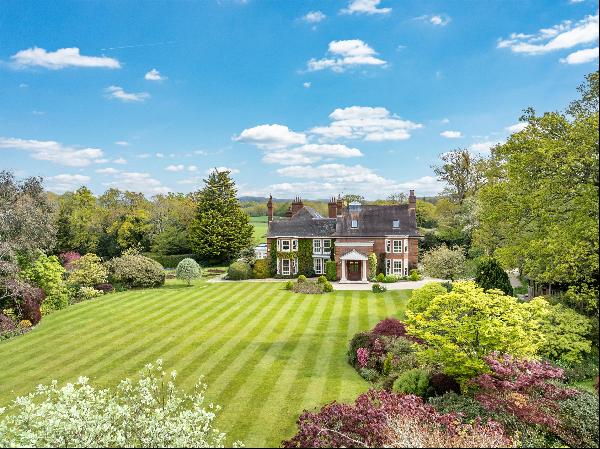 A beautifully presented and impressive country house with stunning landscaped gardens, gro