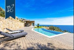 Exclusive luxury property with well-tended green lawns and panoramic pools for sale on the