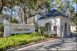 Picturesque lagoon lot with birds and draping oak tree