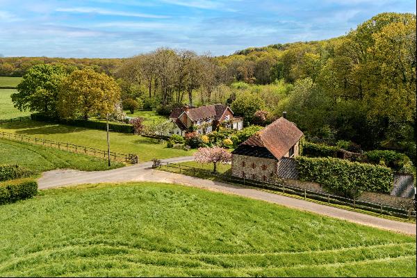 A superb family home with an outstanding barn in a beautiful, secluded setting within the 