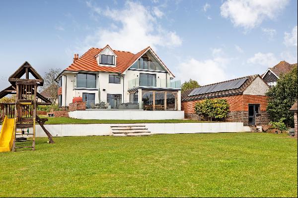 A stylishly appointed detached home with six bedrooms and a beautiful garden, in a sought-