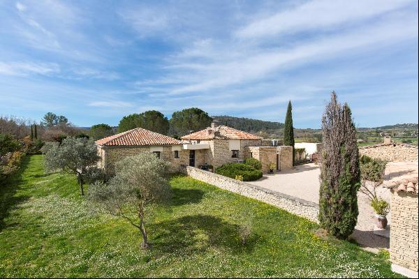 A charming stone property with a swimming pool for sale in Gordes.