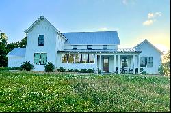Exceptional Farmhouse Home Spanning Over Fourteen Acres!