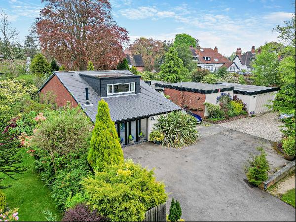 A superb architecturally designed family home set in mature private gardens.