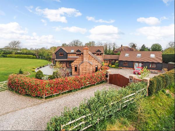 A light and spacious family home with self-contained guest cottage and views across farmla