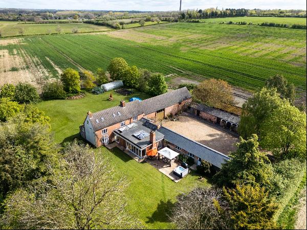 A lovely detached period farmhouse, barn, outbuildings and grounds in a rural location wit