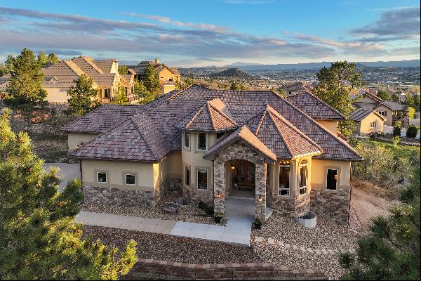This architecturally elegant residence offers panoramic views of Pikes Peak!