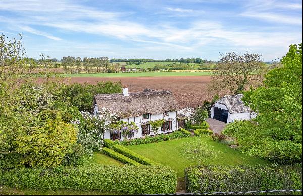 A delightful timber framed cottage dating from the late 16th century, set in over an acre 