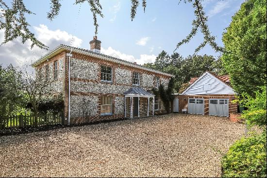 A beautifully renovated traditional Hampshire brick and flint farmhouse with a south-facin