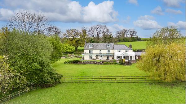 An historic, Grade II listed former vicarage in a beautiful rural location with far reachi