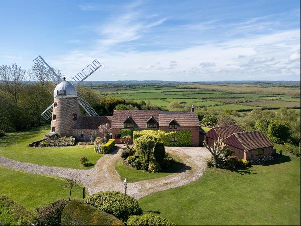 A superb converted windmill and millers house, in an elevated location with stunning 360-d