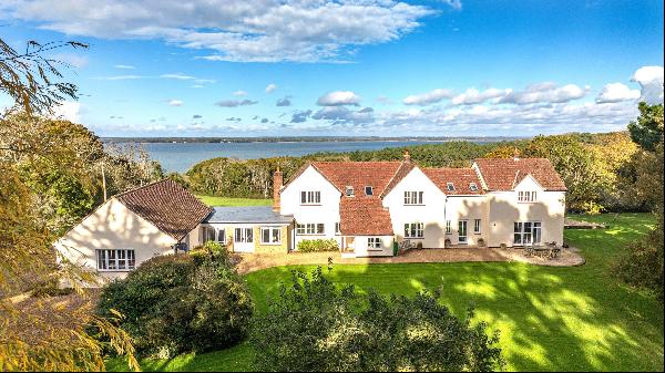 An impressive coastal country house within 26 acres of magnificent grounds, with long rang