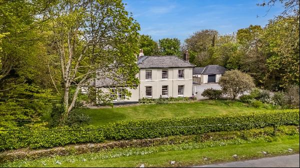 An impressive, late Georgian Grade II listed country house, set in mature grounds in a glo
