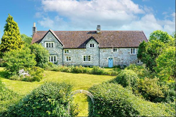 Most attractive Grade II listed  Somerset long house with land and an extensive range of o