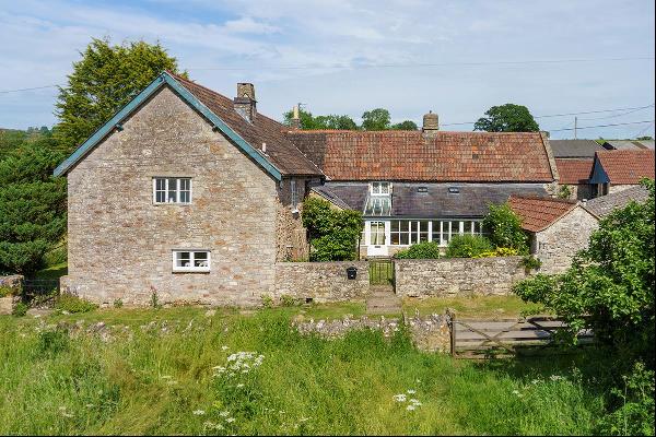 A stunning Grade II listed Somerset long house with 3.96 acres of land and a further 3.64 