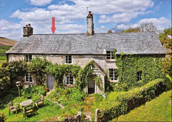 A beautiful and characterful cottage with approximately 1.18 acres of land in the heart of