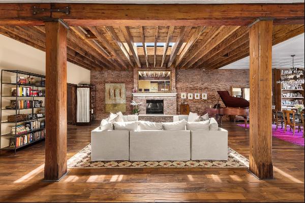 <p>This one-of-a-kind penthouse is a stunning 4-bedroom, 3-bath loft with private roof dec
